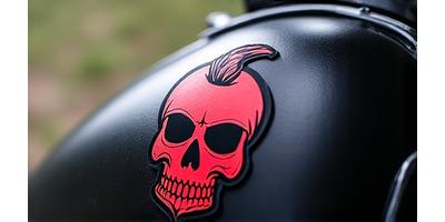 Die-cut motorcycle sticker featuring a stylized rebel skull with a mohawk.